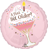 round pink foil balloon with a tini bit older text martini glass design confetti sprinkles and candle detail for birthday party decor