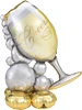 This balloon is in the shape pf a wine glass and its spilling bubbles over the side
