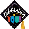 Square balloon shaped like graduation cap with celebrating you text, colorful confetti, and yellow tassel